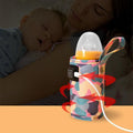 Pink portable USB milk warmer bag for babies, with insulated pouch for on-the-go feeding and bottle heating by Everything Baby.