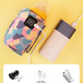 Pink portable USB milk warmer bag for baby bottles, ideal for on-the-go feeding, from Everything Baby.