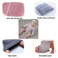 Dark grey crawling knee pads for babies by Everything Baby, featuring cushioned protectors for toddler's knees during play.