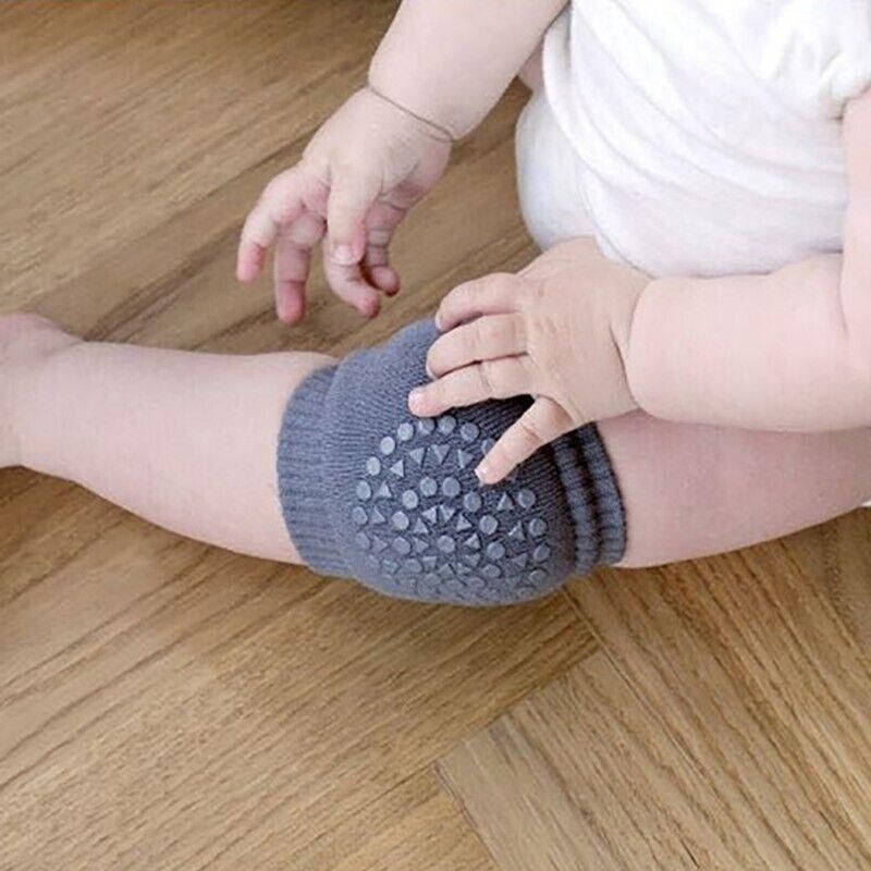 Dark grey crawling knee pads by Everything Baby, soft protective cushion for baby and toddler legs during play and crawling.