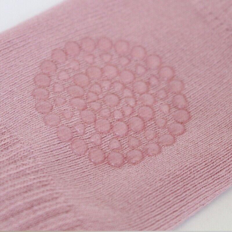 Green crawling knee pads for babies by Everything Baby, featuring soft protective cushions for toddlers' knees.