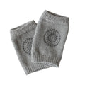 Light grey crawling knee pads for babies by Everything Baby, padded protectors for toddler legs and knees during play.