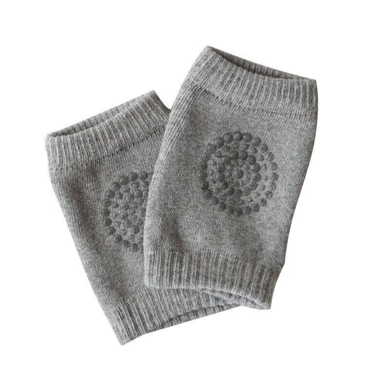 Light grey crawling knee pads for babies by Everything Baby, padded protectors for toddler legs and knees during play.