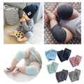 Navy crawling knee pads for babies by Everything Baby, soft protective cushions for toddler knees in a comfortable leg warmer style.