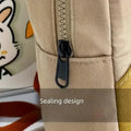Khaki mini dinosaur backpack for kids with adjustable straps, perfect for early learners and daily outings by Everything Baby.