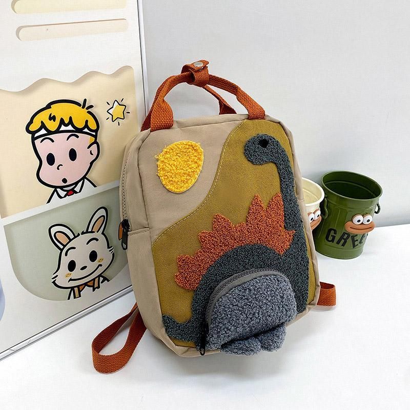 Khaki mini dinosaur backpack for kids, 21x10x26cm, with playful dinosaur design, perfect for early learners and daily outings.