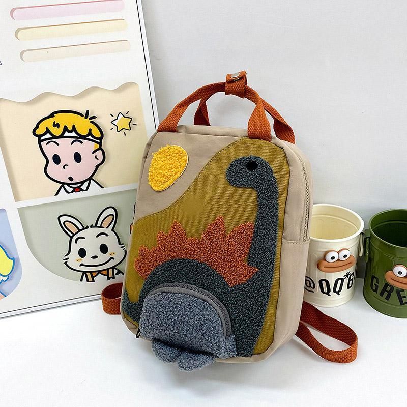 Khaki mini dinosaur backpack for kids, 21x10x26cm, with fun dinosaur design, ideal for early learners and daily outings.