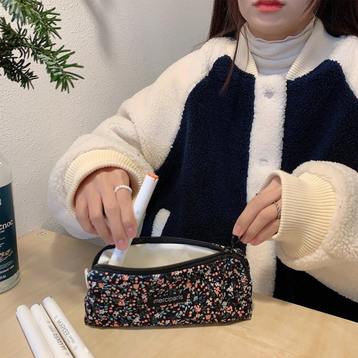 Beige floral corduroy pencil case organizer bag for kids, featuring multiple compartments for stationery and school supplies.
