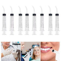 Four disposable dental syringes with curved tips in a set, designed for baby oral irrigation and oral health care by Everything Baby.