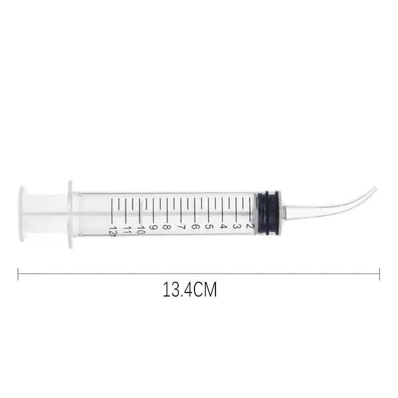 Four disposable 12ml dental syringes with curved tips for baby oral irrigation, from Everything Baby.