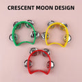 Set of four hand-cranked ring bells from Everything Baby, colorful musical toys for kids, held in a child's hand.