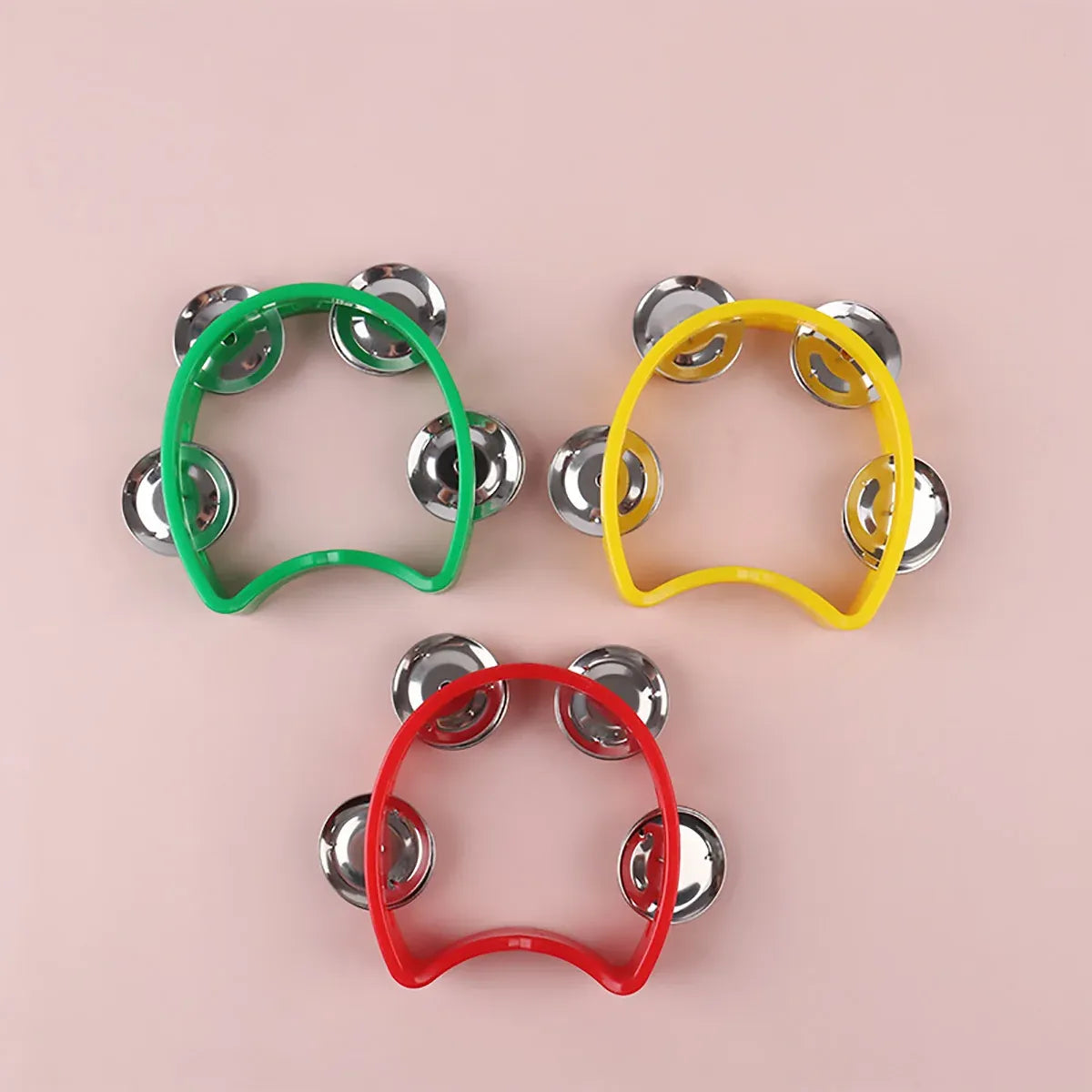 Four hand-held bell set with four colorful ring bells, perfect for kids' musical toys by Everything Baby.