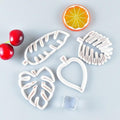 Palm tree, turtle, leaf cookie cutters and fondant molds for cake decorating, ideal for sugarcraft and baking projects.