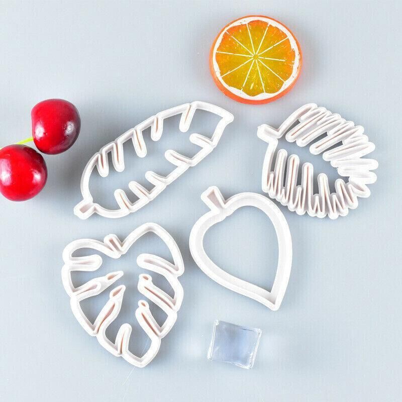 Palm tree, turtle, leaf cookie cutters and fondant molds for cake decorating, ideal for sugarcraft and baking projects.