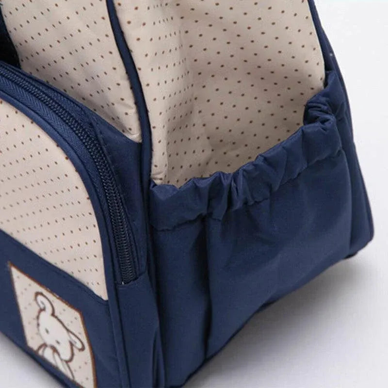 Set of five black baby travel nappy bags with shoulder tote and changing organiser bags for nursing and feeding needs.