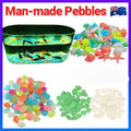 Assorted glow-in-the-dark pebbles and stones in various colors for fish tanks, gardens, and outdoor play, from Everything Baby.