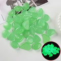 Colorful glow-in-the-dark pebble stones for fish tanks, gardens, and outdoor play, 100-piece set by Everything Baby.