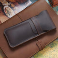 Two vintage handmade genuine leather pencil cases from Everything Baby, cowhide protective holders for kids' pens and pencils.