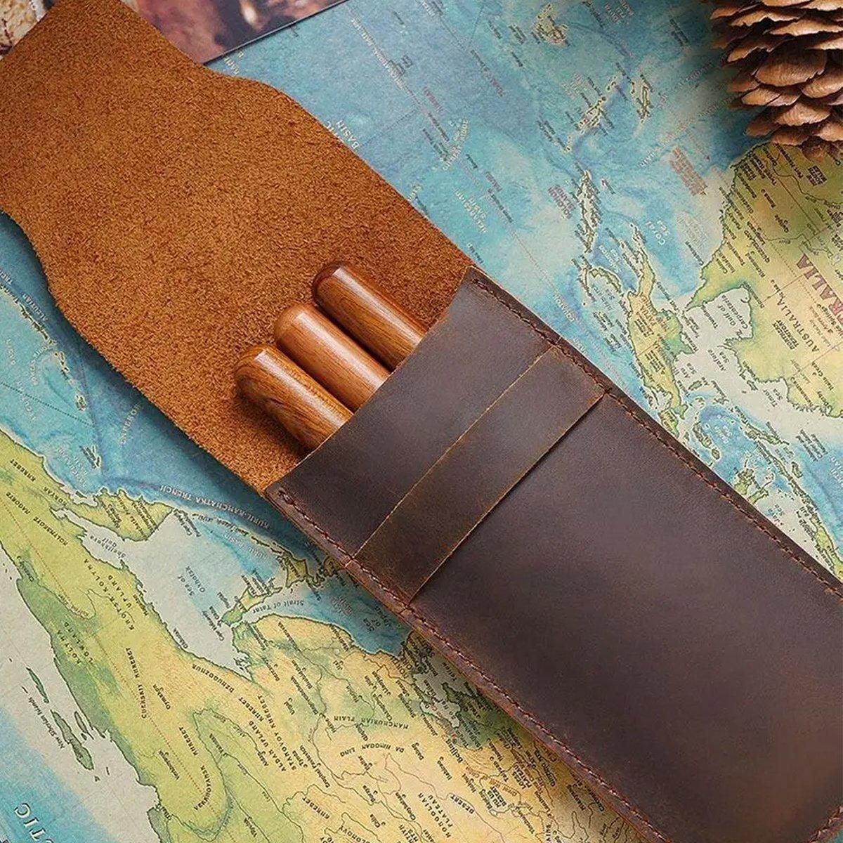 Two vintage handmade genuine leather pencil cases with cowhide protectors, ideal for kids' pens and pencils.