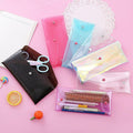 Set of 7 transparent colorful pencil cases with buckles, portable storage bags for kids and baby stationery organization.