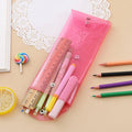 Seven colorful transparent pencil cases by Everything Baby, portable storage bags perfect for kids' pens and pencils.