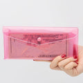Seven-pack transparent colorful pencil cases by Everything Baby, portable storage bags with buckles for kids' stationery organization.