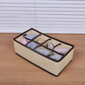 Beige foldable drawer organizer set with dividers for bra and underwear storage in a child's toy or clothing closet.