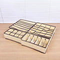 Beige foldable drawer organizer set for bras and underwear, 4-piece storage box dividers in a kid's toy storage context.