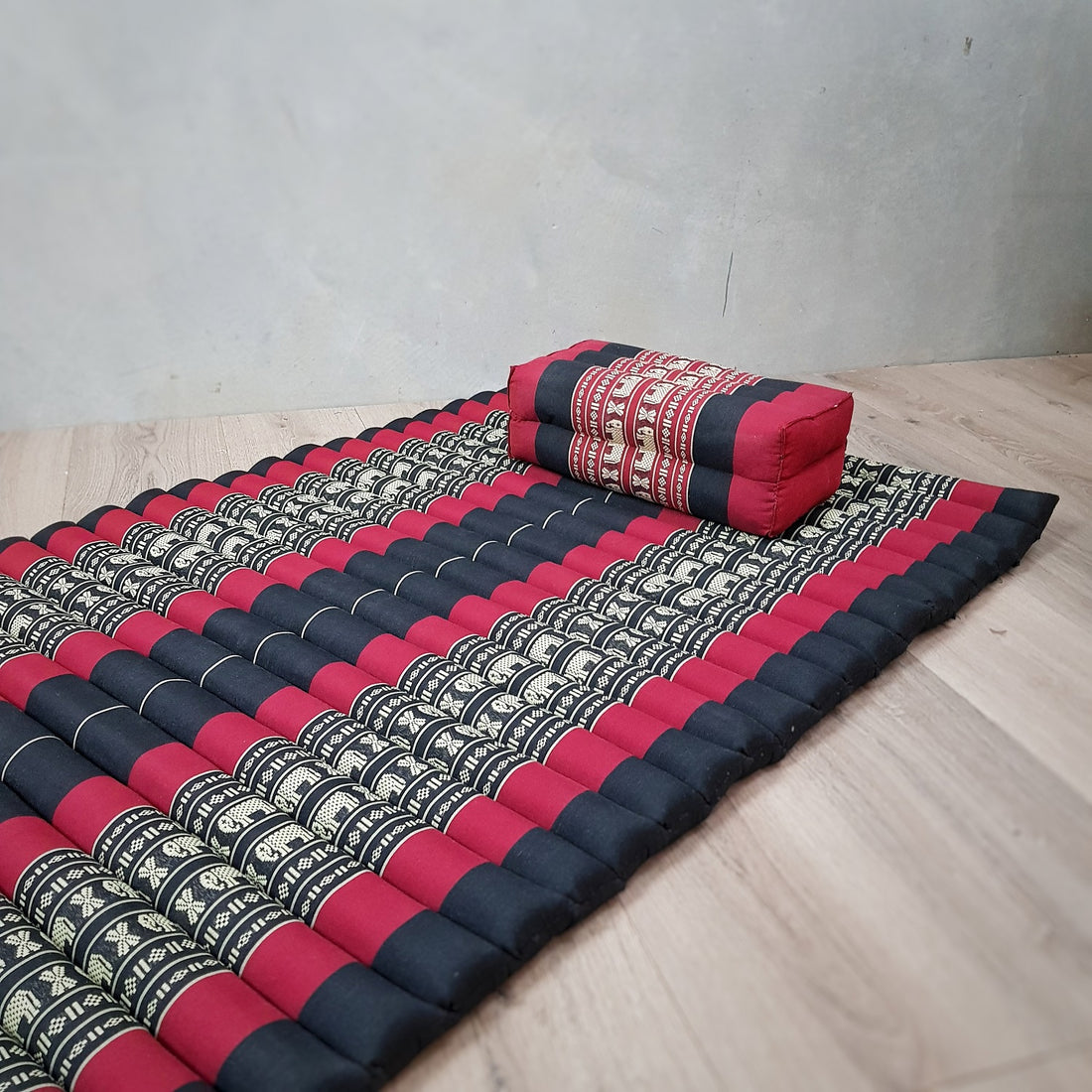 Foldable baby mattress and pillow set in red, by Everything Baby, designed for toddlers and young children, shown in bright red fabric.