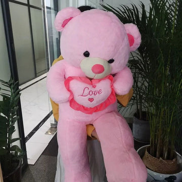 Giant plush Valentines Love Bear pillow by Everything Baby, soft pink stuffed toy with heart details for kids' cuddly toy.