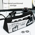 Black and white double-zip pencil case by Everything Baby with front pocket, wrist strap, and 3D patch for stationery storage.